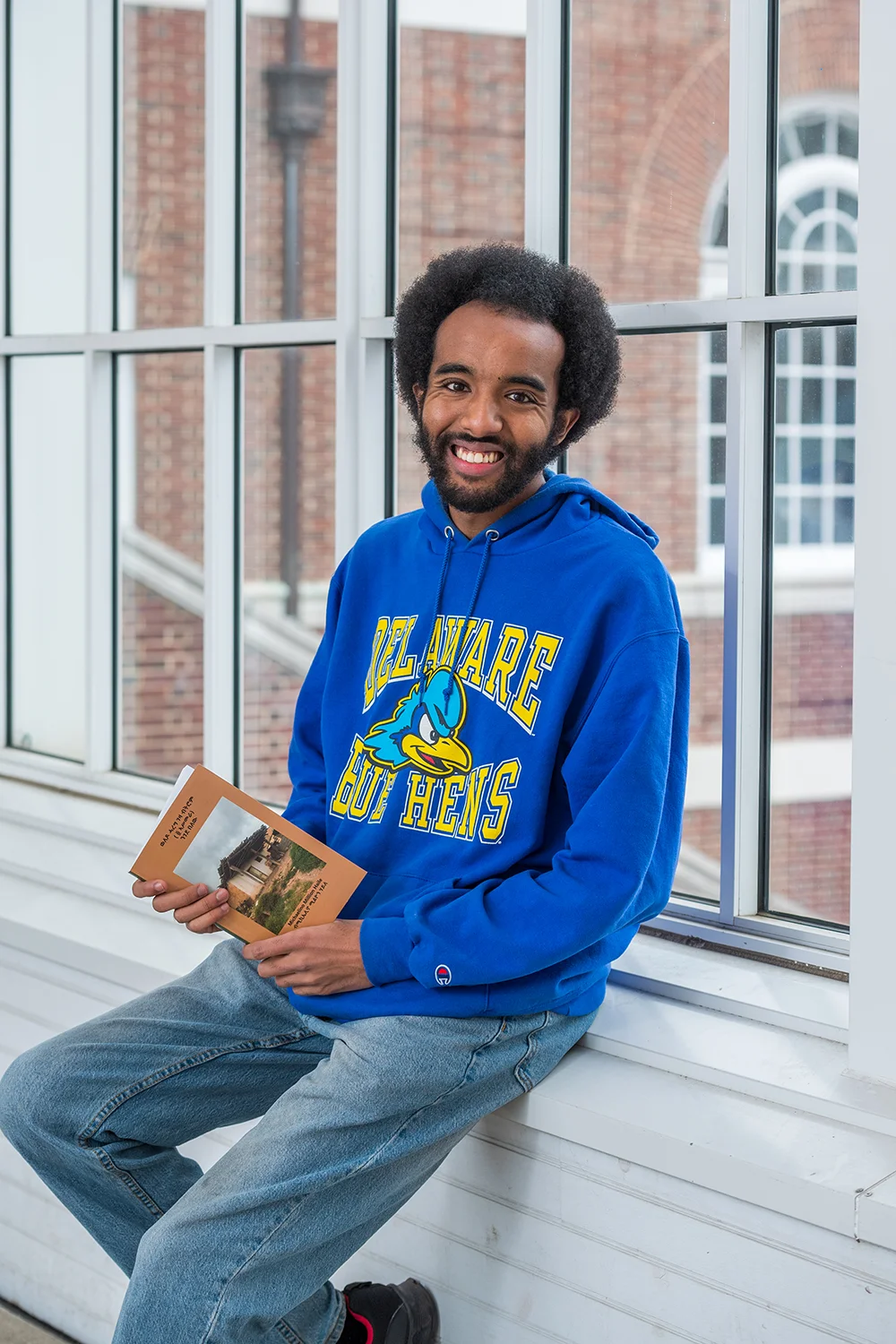 A student prepares for graduation from CLSC