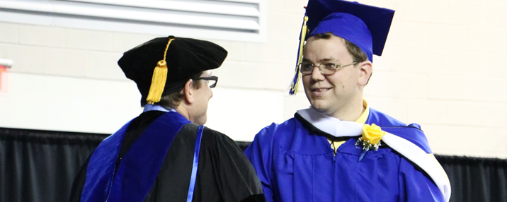 CDS's Brian Freedman congratulates a recent CLSC graduate