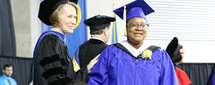 CEHD Dean Carol Vukelich and CLSC (classic) student at convocation