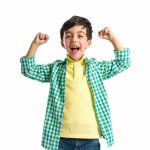 stock photo of boy raising fists in triumph