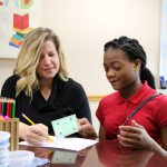 Baltz Principal Amy O’Neill supports student as she sets her goals for the school day.