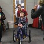 Mason Read tries out his new adaptive bicycle