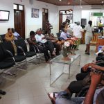 Patients sitting in hospital waiting room