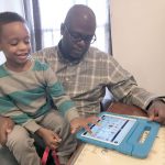 Parent Daren Gayle plays with autistic son DJ