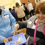 Volunteer Laura Cantagallo lends support to participant Linny Marbel at our 11th Artfest