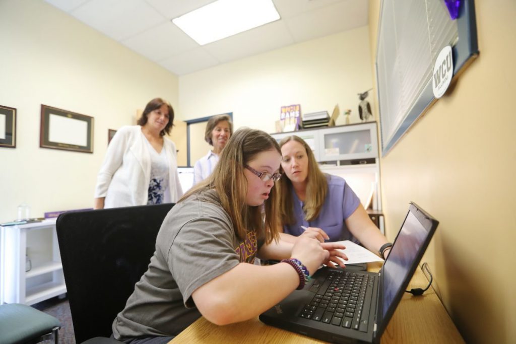 Student with disabilities meets her professor and adviser.