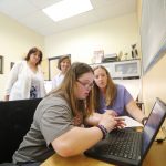 Student with disabilities meets her professor and adviser.