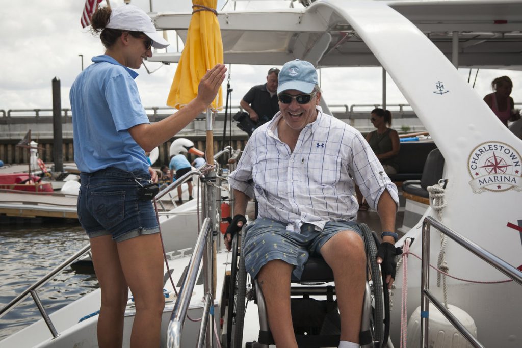 A high five is exchanged between two members of the ship's crew