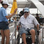 A high five is exchanged between two members of the ship's crew