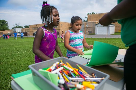 Layla Arthurs (left) and Jimena Gonzalez Coello do some drawing during the Friday water day
