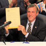 Governor John Carney signs SB 230