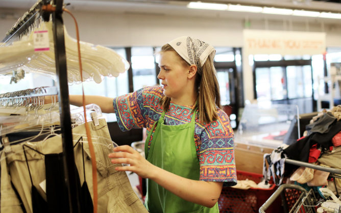vocational rehabilitation program participant on the job at thrift store