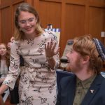 Finnigan Madison, a UD student with autism, speaks with Spectrum Scholars graduate assistant Kerry Pini (standing) at the Spectrum Scholars launch in September.