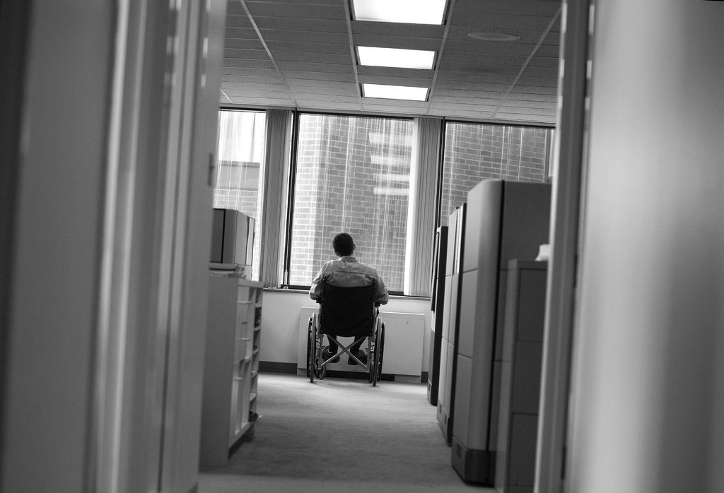 man in wheelchair in office