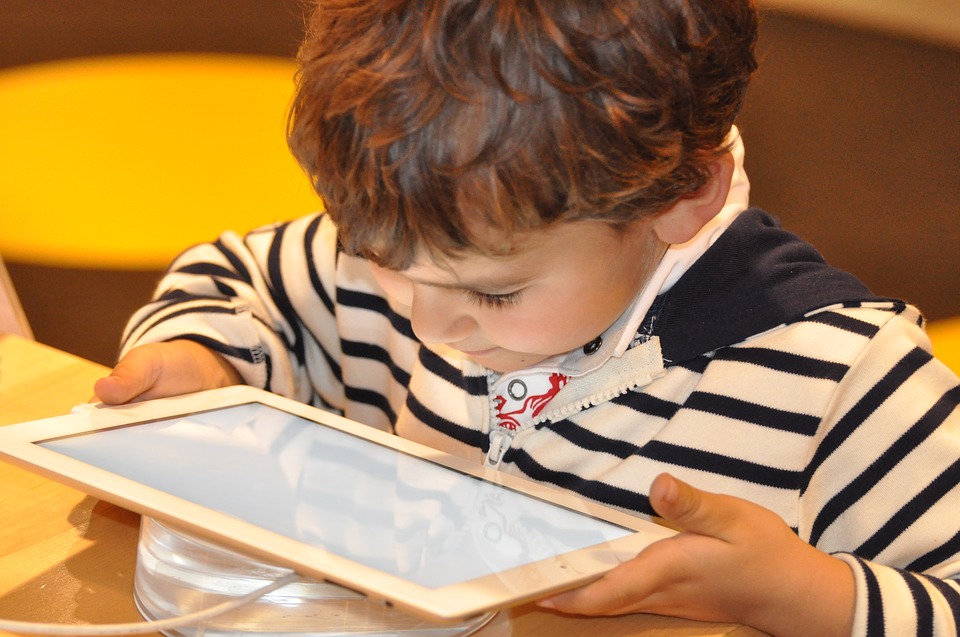Toddler aged child with tablet device