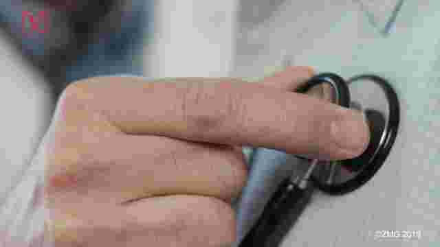 Doctor using stethoscope