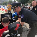 ADAPT protester in wheelchair being arrested