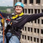 Man taking part in the Over the Edge event