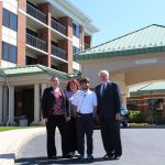 Rebecca Streets-Montagna, Donna Hopkins, Ian Snitch and Bill Sullivan pose in front of hotel where Ian was hired to work.