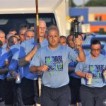 Mark W. Kristunas leads a group of police recruit runners as they accompany the torch