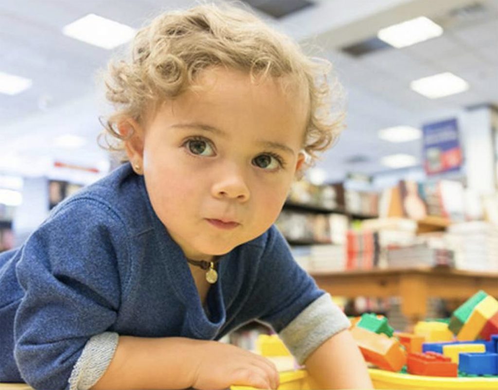 young child playing with blocks