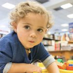 young child playing with blocks