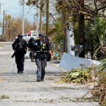 A FEMA task force goes house-to-house looking for residents after a hurricane