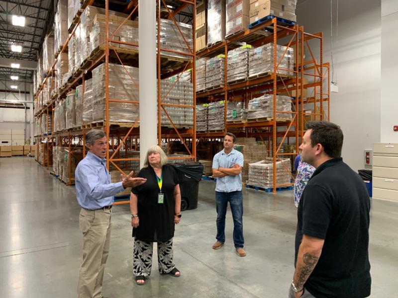 Governor John Carney of Delaware with representatives from and at the Food Bank of Delaware in Newark