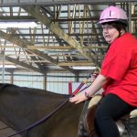 Tyra Eskridge on horseback