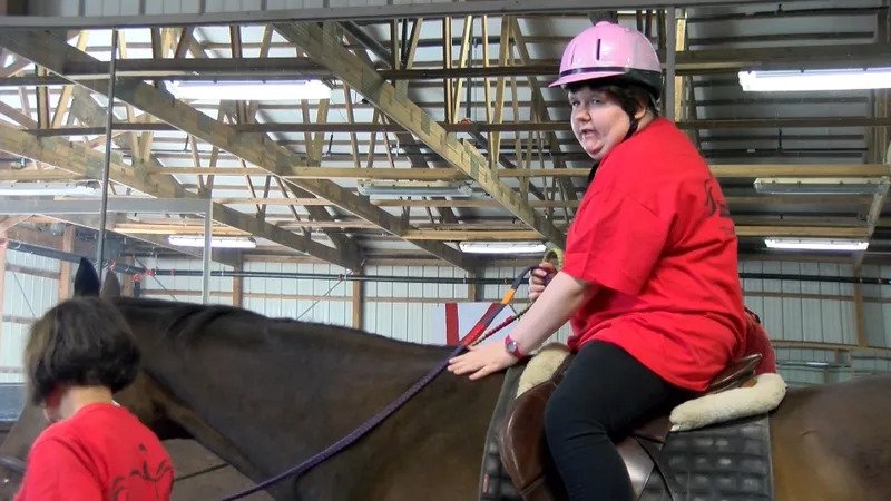 Tyra Eskridge on horseback