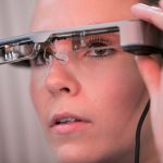 Woman wearing Smart Caption glasses