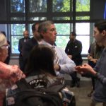 Governor John Carney speaks with Max Grozovsky after a town hall meeting at the University of Delaware's Trabant Student Center