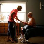 Marilyn Long, left, helps her brother, Jeff Malanoski who has Down syndrome and Alzheimer's disease