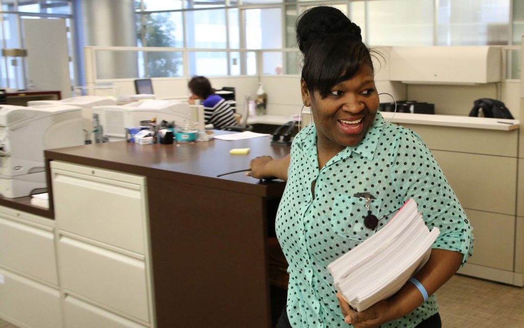 Shalonda Sanders, who has a disability, works the mailroom beat delivering letters, documents and packages to law office employees at Seyfarth Shaw in Chicago