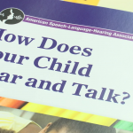 A stack of brochures from the American Speech-Language-Hearing Association entitled "How Does Your Child Hear and Talk?"
