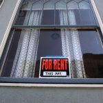 A For Rent sign in apartment window