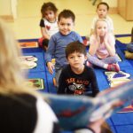 Pre-kindergarten students are read a book