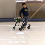 Bryan Kreps plays a game modeled after soccer and air hockey using the iGYM system at the university in Ann Arbor, Michigan