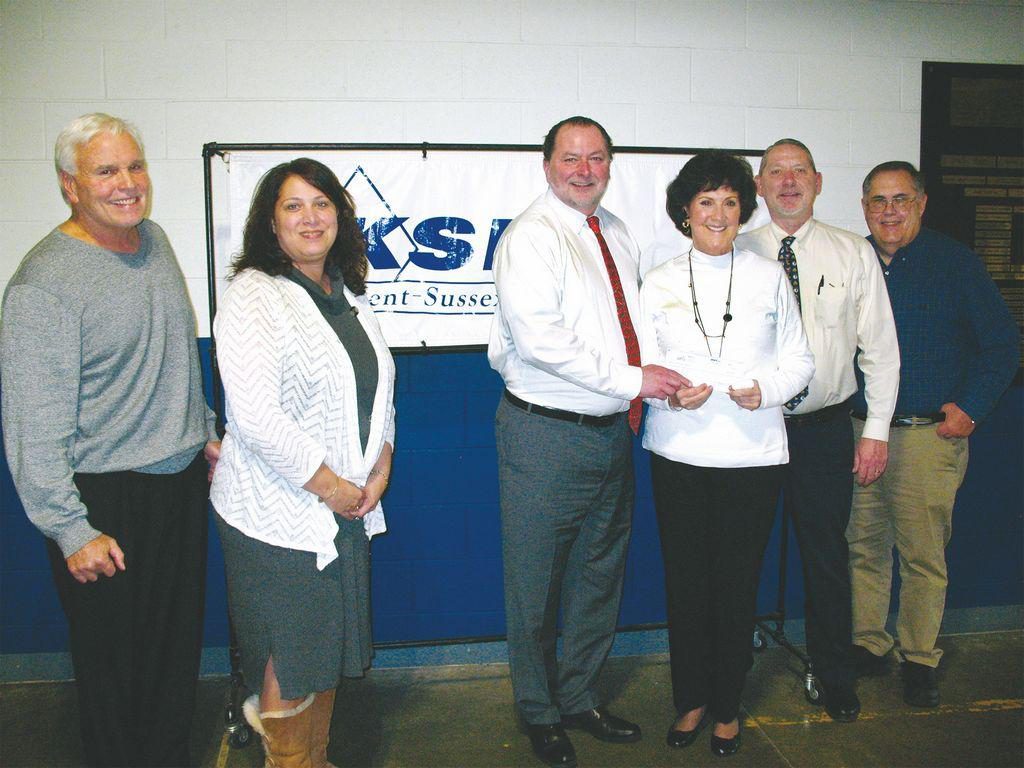 DFRC Executive Director Tony Glenn, far left, presents the foundations most recent donation to Kent-Sussex Industries Inc., with Ann Haggerty, KSI supported employment manager; B. Craig Crouch, KSI CEO; Marty McDonough, of DFRC; Jayson Crouch, KSI vice president; and Jim Greenwell, KSI comptroller.