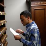 Jordan Allison, who has autism, works as a swatch and button specialist in the special order department at Hart Schaffner Marx in Des Plaines, Illinois