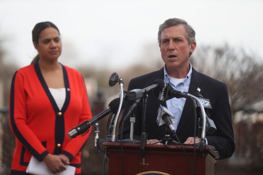 Governor John Carney gives an update on the coronavirus situation in Delaware Wednesday during a press conference outside the Carvel State Building in Wilmington.