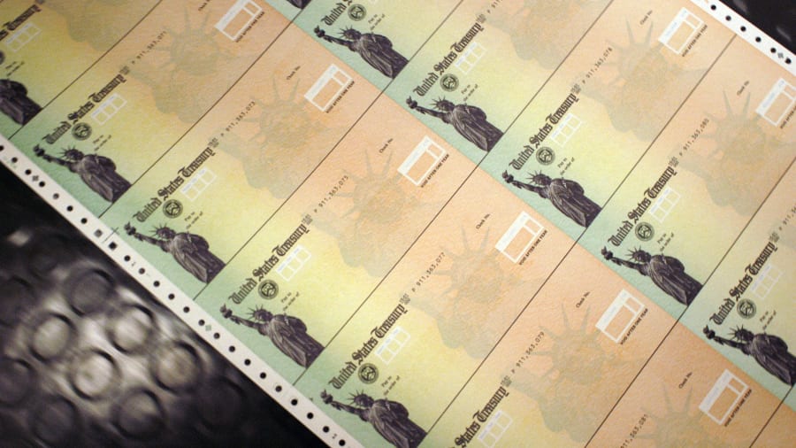 Blank Social Security checks are run through a printer