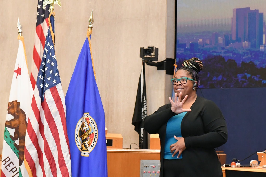 Rorri Burton interpreting for Barbara Ferrer, the director of the Los Angeles County Department of Public Health.