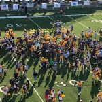 DFRC Blue-Gold Football Game participants meet with their Hand-and-Hand Buddies before the 2019 Game.