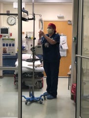 Josie Robinson, a nurse at ChristianaCare’s emergency department at Christiana Hospital, works during the coronavirus pandemic.