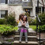 Dania Palanker with her daughter and husband in the front yard of her Washington, DC, home.