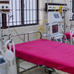 A staffer checks on a ventilator in an intensive care unit in Chennai, India, Friday. States in the U.S. are coming up with plans for what to do if they run out of ventilators and other supplies.