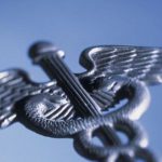 Stylized illustration of the caduceus, a winged staff with two snakes entwined traditionally associated with healing