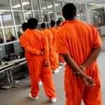 teenagers head toward the gym at Caddo Juvenile Detention Center in Shreveport, La.