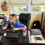 Principal Kristina MacBury of Sarah Pyle Academy in Wilmington, Del., checks in with a student from her home office.